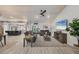 Open-concept living room with wood ceiling, tile floors, and view into the kitchen at 307 Bucknell Rd, Venice, FL 34293