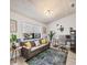 Home office area with a comfortable sofa, natural light, and a sleek workstation at 307 Bucknell Rd, Venice, FL 34293