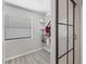 Pantry with a window, modern shelving, and a sliding black framed glass door at 307 Bucknell Rd, Venice, FL 34293