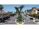 Street view featuring a palm-lined road with shops and buildings in a vibrant downtown area at 307 Bucknell Rd, Venice, FL 34293