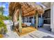 Backyard tiki hut featuring a picnic table, ideal for casual outdoor dining and entertaining guests at 307 Bucknell Rd, Venice, FL 34293