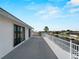Large balcony with white railings offering picturesque canal views and a glimpse of waterfront living at 318 Oakwood Cir, Englewood, FL 34223