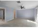 Serene bedroom with a ceiling fan, tile floors, and an ensuite bathroom with glass enclosed shower at 318 Oakwood Cir, Englewood, FL 34223