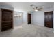 Bedroom with three built-in bookshelves, light blue walls, and a ceiling fan at 318 Oakwood Cir, Englewood, FL 34223