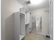 Walk-in closet featuring custom shelving and ample storage space, with access to bedroom at 318 Oakwood Cir, Englewood, FL 34223