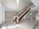 Grand foyer with a staircase, modern chandelier, and bright natural light at 318 Oakwood Cir, Englewood, FL 34223