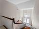 Foyer with high ceilings, a chandelier, and a view of the front door and windows at 318 Oakwood Cir, Englewood, FL 34223