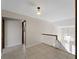 Hallway view with tile flooring and a staircase to the second floor at 318 Oakwood Cir, Englewood, FL 34223