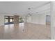 Open floor plan with modern finishes and access to the outdoor living area at 318 Oakwood Cir, Englewood, FL 34223