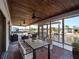 Spacious screened patio with comfortable seating and waterfront views, ideal for outdoor relaxation and entertaining at 318 Oakwood Cir, Englewood, FL 34223
