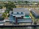 Waterfront home featuring a private pool, deck, and outdoor space perfect for relaxing and entertaining at 318 Oakwood Cir, Englewood, FL 34223