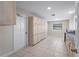 Utility room with ample cabinet storage, sink, and access to the backyard at 318 Oakwood Cir, Englewood, FL 34223