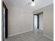 Versatile room with tile flooring and neutral tones, leading to additional living spaces at 318 Oakwood Cir, Englewood, FL 34223
