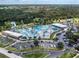Aerial view of a vibrant water park with pools, slides, and ample parking at 3255 Tally Ho Rd # 1, North Port, FL 34291