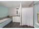 This bathroom features a tub, shower, and vanity at 3255 Tally Ho Rd # 1, North Port, FL 34291