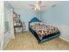 Blue bedroom with a statement bed, and vanity, offering comfort and style at 3255 Tally Ho Rd # 1, North Port, FL 34291