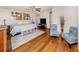 The primary bedroom features a ceiling fan, hardwood floors and sitting area at 3255 Tally Ho Rd # 1, North Port, FL 34291