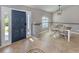 Inviting foyer with tile floors, decorative inlay, and a view into the dining area with a pendant light at 3255 Tally Ho Rd # 1, North Port, FL 34291