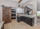 Kitchen featuring custom cabinets, granite countertops, and stainless steel appliances at 3255 Tally Ho Rd # 1, North Port, FL 34291
