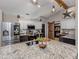 Bright kitchen with granite counters, modern appliances, and decorative lighting at 3255 Tally Ho Rd # 1, North Port, FL 34291