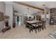 Open-concept living area with kitchen island featuring a breakfast bar, a light and bright space at 3255 Tally Ho Rd # 1, North Port, FL 34291
