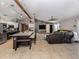 Open-concept living space with a large island, modern kitchen, and comfortable seating area with a ceiling fan at 3255 Tally Ho Rd # 1, North Port, FL 34291