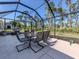 This screened in patio features an outdoor table with seating for six at 3255 Tally Ho Rd # 1, North Port, FL 34291