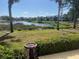 Picturesque backyard view featuring lush foliage and water views at 406 Laurel Lake Dr # 103, Venice, FL 34292