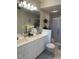 Clean, bright bathroom with double sinks and glass-enclosed shower at 406 Laurel Lake Dr # 103, Venice, FL 34292