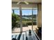 Bright sunroom area offering serene water views and a relaxing atmosphere at 406 Laurel Lake Dr # 103, Venice, FL 34292