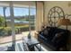 Inviting living room with stunning waterfront views and comfortable seating at 406 Laurel Lake Dr # 103, Venice, FL 34292