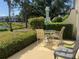Back patio featuring outdoor seating and a view of the water at 406 Laurel Lake Dr # 103, Venice, FL 34292