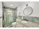 Bathroom featuring a granite vanity top and a glass enclosed shower at 421 Blackburn Rd, Nokomis, FL 34275