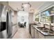 Bright and functional kitchen featuring stainless steel appliances, updated cabinetry, and open layout at 421 Blackburn Rd, Nokomis, FL 34275
