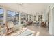 Bright sunroom with lots of windows and tile flooring at 421 Blackburn Rd, Nokomis, FL 34275