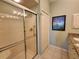 Bathroom featuring walk-in shower and granite-topped vanity at 4213 Vicenza Dr # A2, Venice, FL 34293