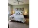 Cozy bedroom with calm colors, ceiling fan and bright windows at 4213 Vicenza Dr # A2, Venice, FL 34293