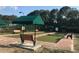 An inviting bocce ball court with bench seating and sun protection, offering a fun recreational activity at 4213 Vicenza Dr # A2, Venice, FL 34293