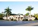 Beautiful clubhouse featuring tropical landscaping, a spacious parking lot and elegant architectural design at 4213 Vicenza Dr # A2, Venice, FL 34293
