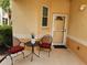 Inviting front porch with outdoor seating, creating a cozy space to welcome guests at 4213 Vicenza Dr # A2, Venice, FL 34293