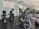 Gym featuring cardio equipment, free weights, mirrors, ceiling fans, and bright overhead lighting at 4213 Vicenza Dr # A2, Venice, FL 34293