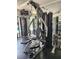 Close up of a multi gym with weight machine surrounded by mirrors and bright lighting at 4213 Vicenza Dr # A2, Venice, FL 34293