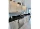 Close-up of the kitchen featuring stainless steel appliances and granite countertops at 4213 Vicenza Dr # A2, Venice, FL 34293