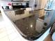 Kitchen featuring granite countertops, stainless steel appliances and white cabinets at 4213 Vicenza Dr # A2, Venice, FL 34293