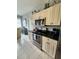 Open kitchen featuring stainless steel appliances and ample cabinet space at 4213 Vicenza Dr # A2, Venice, FL 34293