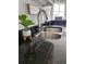 A close up of a kitchen sink, faucet and granite countertops at 4213 Vicenza Dr # A2, Venice, FL 34293