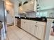 Well-equipped kitchen with black granite counters, stainless steel appliances and light cabinetry at 4213 Vicenza Dr # A2, Venice, FL 34293