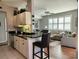 Open concept living area with bar seating, natural light, and comfortable furnishings at 4213 Vicenza Dr # A2, Venice, FL 34293