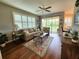 Inviting living room with neutral decor, plantation shutters, and access to the outdoor lanai at 4213 Vicenza Dr # A2, Venice, FL 34293