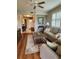 Comfortable living room showcases a floral rug and large windows with plantation shutters at 4213 Vicenza Dr # A2, Venice, FL 34293